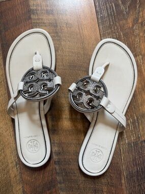 Tory Burch Cream Miller Logo Thong Sandals with Silver Emblem